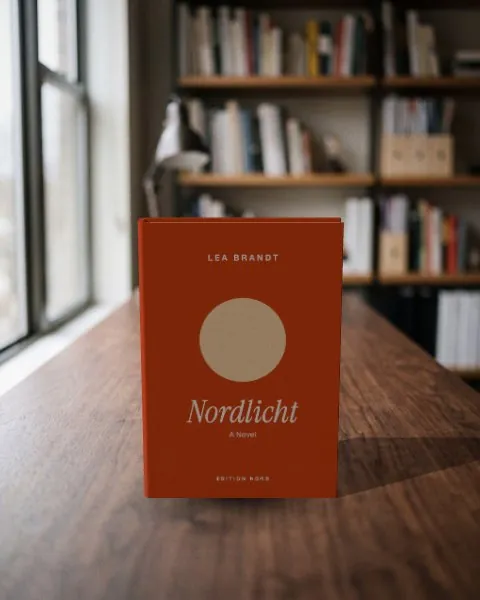 Hardcover book · Walnut desk mockup