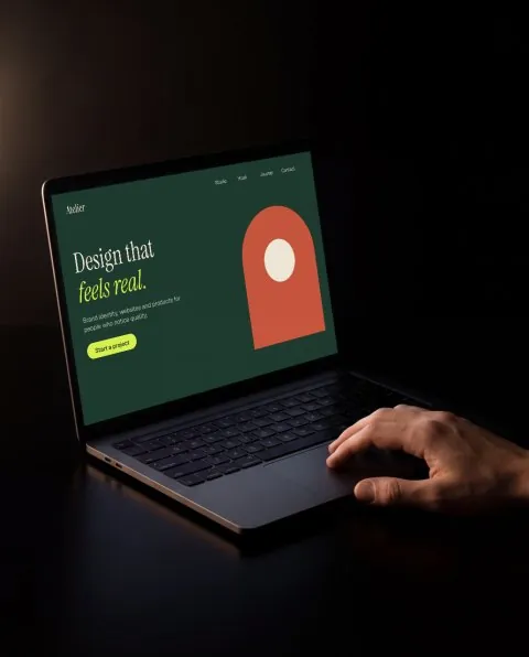 Laptop with hand, black mockup