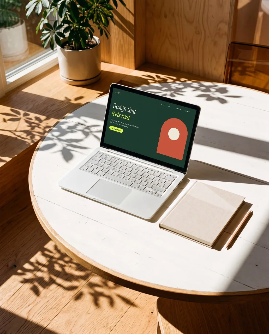 Laptop on a round table mockup