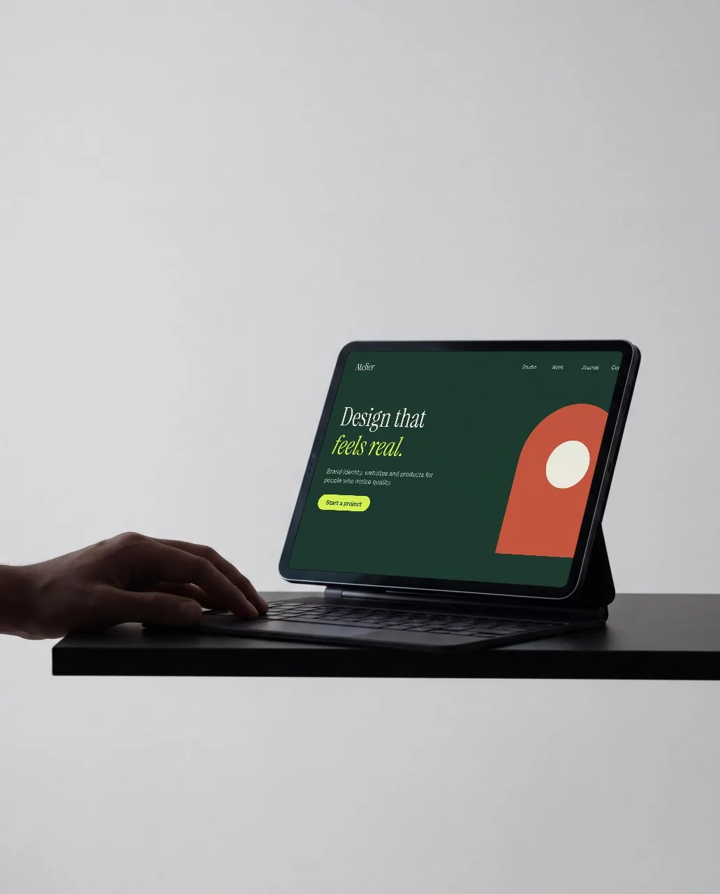 Tablet on keyboard stand, grey studio mockup
